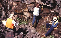 Geologists investigate layer of tephra preserved beneath lava flow on Kilauea Volcano