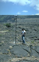 Scientist checks radio telemetry from seismic station