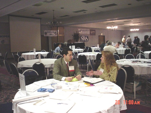 George Ralis (OSDBU) meeting with a small business owner. 