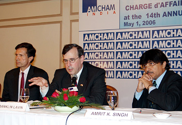 U.S. Under Secretary for International Trade Franklin L. Lavin (center) addressing American Chamber of Commerce (AMCHAM) members in New Delhi, May 1, 2006. Also seen in the picture are U.S. Chargé d'Affaires Robert O. Blake (left) and AMCHAM President Amrit K. Singh (right). 