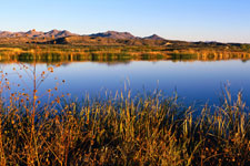 Image: A body of water with mountains in the distance.