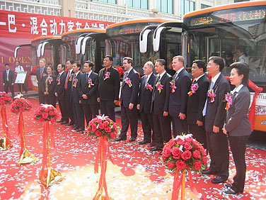 David Bohigian, assistant secretary of commerce for market access and compliance (center), along with representatives of the Eaton Corp. and the Beiqi Foton Bus Company, participate in a ceremony in the city of Guangzhou, China.