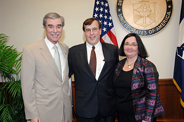 Secretary of Commerce Carlos M. Gutierrez (left) with Under Secretary for International Trade Franklin L. Lavin (center) and his wife, Ann Lavin (right). Gutierrez presented Lavin with the William C. Redfield award on the occasion of Lavin’s farewell reception on July 13, 2007. (U.S. Department of Commerce photo)