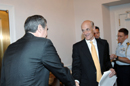 Secretary Gutierrez and Secretary Chertoff shake hands