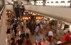 Riders boarding a heavy rail vehicle.  Transit offers a way for people to travel - yet  save energy and reduce greenhouse gas emissions.  (Photo courtesy of WMATA)