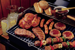 Image of food on a grill linking to information on cooking food safely