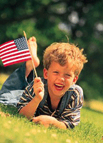 Image of boy holding flag linking to USA.gov 4th of July page