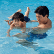 Image of father and son in a pool linking to water safety article.