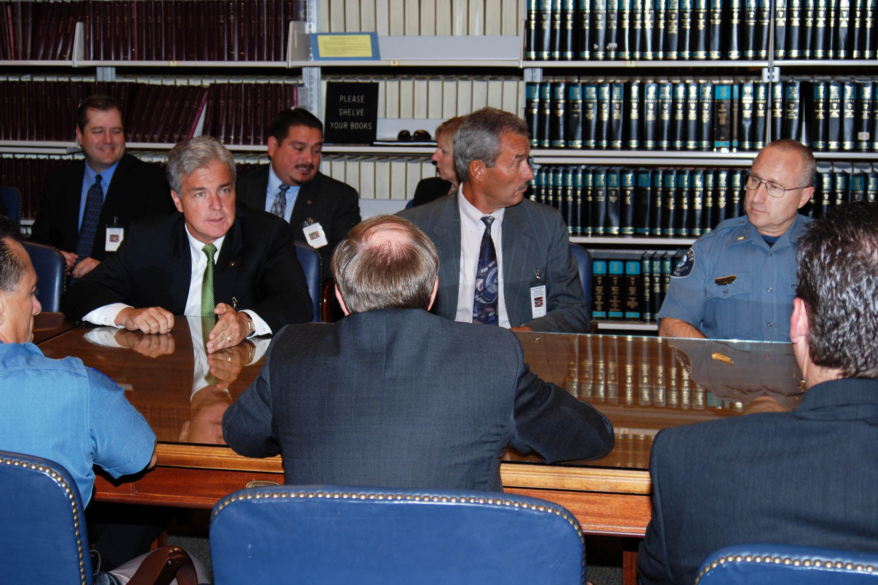 Members of the Metro Gang Task Force brief Attorney General Michael Mukasey