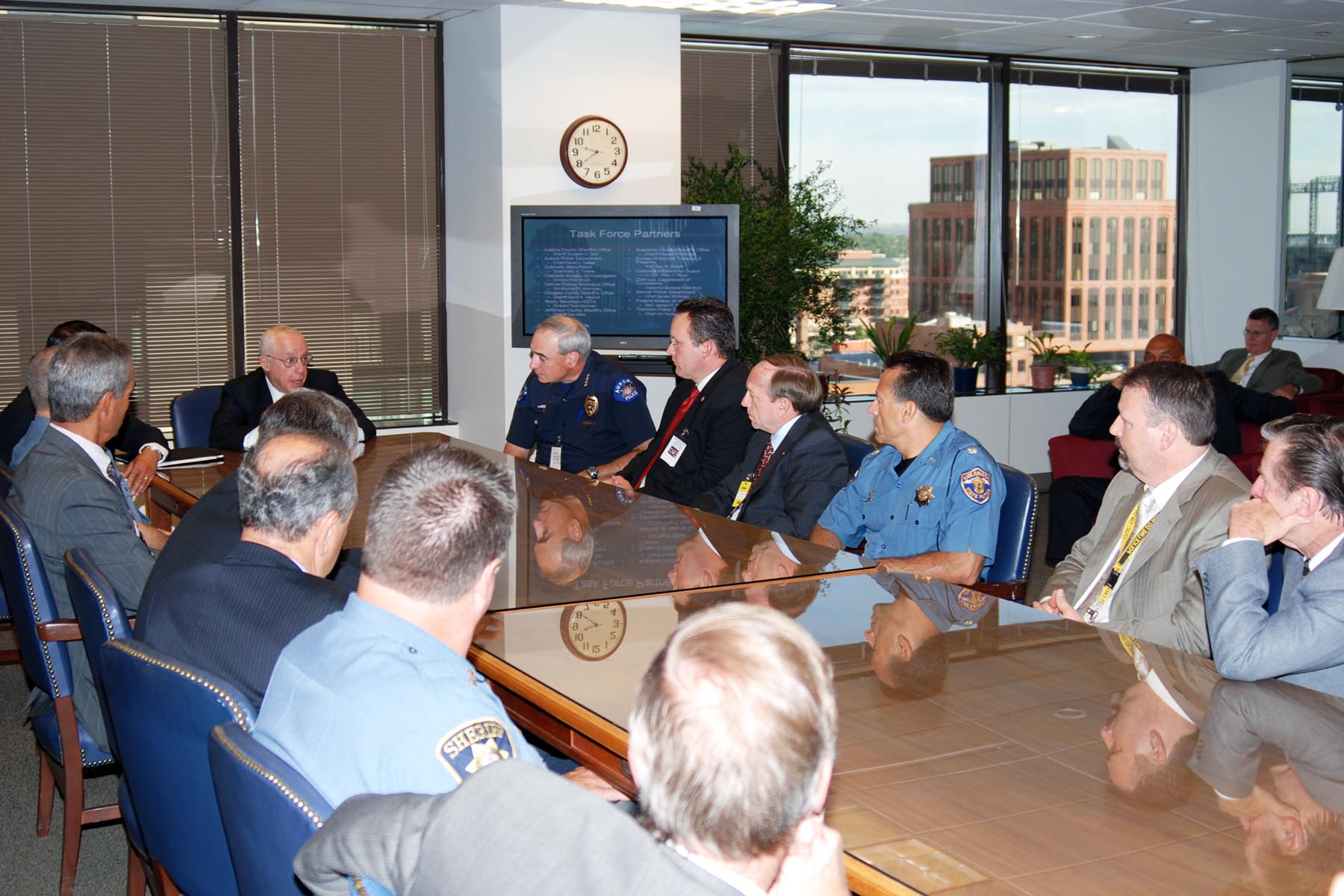 U.S. Attorney General Michael Mukasey and U.S. Attorney Troy Eid meet with members of the Metro Gang Task Force