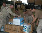 U.S. Army soldiers assigned to the 647 Quartermaster Company rig bundles of Humanitarian Daily Rations ,HDRs, for airdrop by U.S. forces into Iraq 