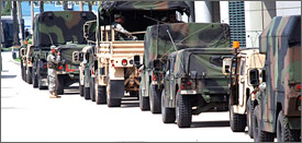 Members of the Louisiana National Guard’s 256th Infantry Brigade Combat Team stage their vehicles in Lot J next to the Ernest Morial Convention Center, Aug. 30, 2008.