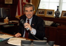 Secretary Gutierrez with telephone in hand.