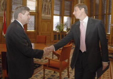 Deputy Secretary Sampson (left) shaking hands with Hungarian Prime Minister.  Click here for larger image.