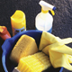 Cleaning supplies and sponges in bucket