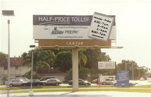 An image of a billboard sign displaying Half-Priced Tolls at certain times of the day Monday thru Friday.