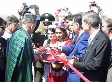 Gutierrez and Presidents Karzai and Rahmon are seen cutting ribbon at bridge ceremony. Click here for larger image.