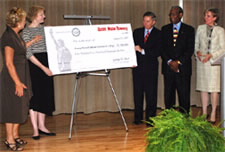 Photo of Sheetz, Graham and others at check presentation. Click here for larger image.