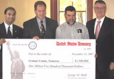 EDA Assistant Secretary Baruah (far left) presents $1.5 Million check to officials from Grainger County, Tennessee.