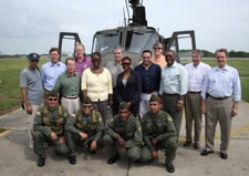 Gutierrez and Members of Congressional Delegation Pose in Front of Helicopter with Colombian Military Forces