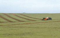 Azerbaijan’s wide plains lend themselves to mechanical demining with heavy machinery as seen here. [ArmorGroup]