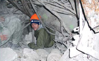 In addition to working with NATO to destroy its national stockpiles of excess and aging arms and munitions, Ukraine is also still clearing explosive remnants of war dating back to World War II left from the savage fighting between Soviet and Nazi forces. Here, a Ukrainian deminer 35 meters (over 114 feet) from the surface, carefully examines a section of underground ammunition storage depot complex on the Crimean peninsula. Several such depots, filled with tons of Soviet Army munitions, blew up in 1942, leaving behind significant quantities of unexploded ordnance that continue to pose a threat to inhabitants and to infrastructure within a three-kilometer (nearly two miles) radius. [Ukroboronservice]