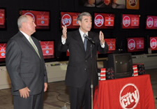 Governor Perdue and Secretary Gutierrez seen with DTV converter coupon and Circuity City logos in background. Click for larger image.