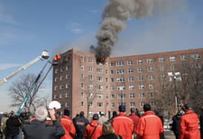 Image of an abandoned apartment building on fire. Click for larger image.