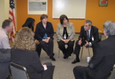 Gutierrez meets with leadership in a circle.  Click for larger image.