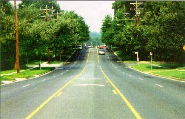 Photo of a five lane street. Middle lane is a twoway leftturn lane.