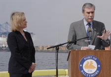 Ambassador Schwab and Secretary Gutierrez with port in background. Click here for larger image.