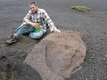 Ben Haravitch posing alongside one of the 364 large rocks that he measured (length, width, and height) in the southern part of Kilauea's caldera.