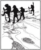 Image of hikers walking on rocks through the stream