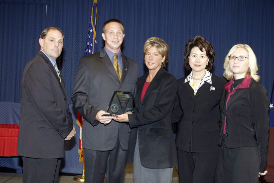 Chuck Canterbury, National President, The Fraternal Order of Police; Steve Young (son of Steve Young); DeniseYoung (widow of Steve Young); Secretary of Labor Elaine L. Chao; and Karen Young (daughter-in-law of Steve Young). (DOL Photo)