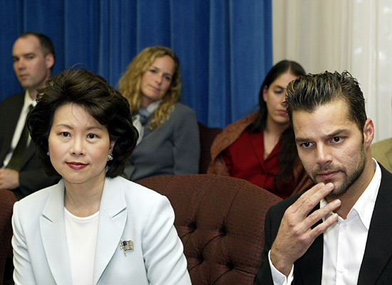 Labor Secretary Elaine L. Chao sits with Grammy award winner and UNICEF Goodwill Ambassador Ricky Martin.