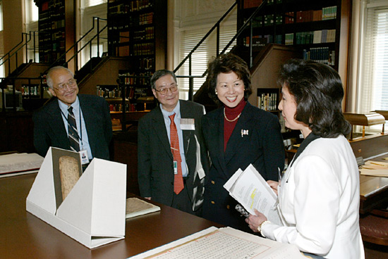 Dr. Hwa-Wei Lee, Chief of the Asian Division; Dr. Chi Wang, Head of the Chinese Section; Secretary of Labor Elaine L. Chao; and Dr. Mi Chu Wiens, Specialist in Chinese Culture