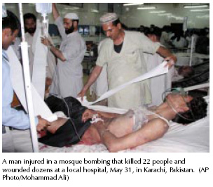 A  man injured in a mosque bombing that killed 22 people and wounded dozens at a local hospital, May 31, in Karachi, Pakistan. [AP Photo/Mohammad Ali]