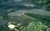 Pahoehaoe lava crosses road