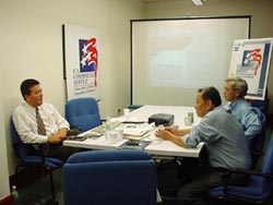 A Gold Key client in a meeting scheduled by CS Singapore.