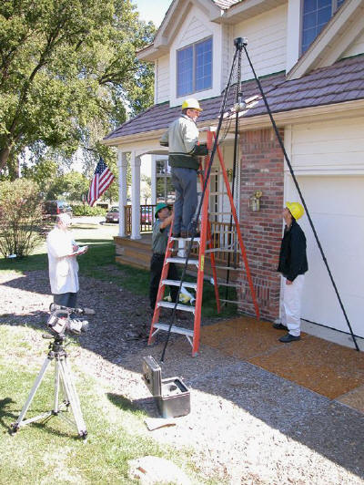 Tripod erected over test surface to conduct ASTM F-1292 test (photo)