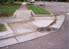 Photo of combined curb ramp at corner.