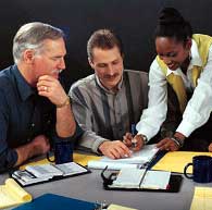 three people convened in a meeting