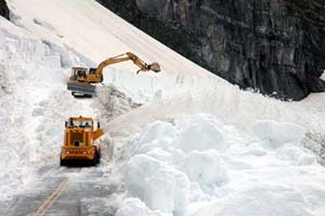 Heavy machinery working on clearing Going-to-the-Sun Road.