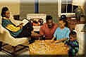 Image of a family in front of a wood stove