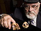 Photo of Elwyn Simons and skull fossils
