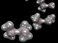 Two oxygen atoms on different molecules are connected by their mutual attraction to an extra proton, shown as a fuzzy ball between them. The presence of such intermolecular binding can now be identified by monitoring the precise vibrational frequency of the bridging proton. Photo credit: Yale