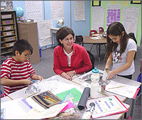 Photo of Del Pueblo School  CLOUT students working on a science project with their teacher.