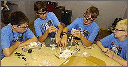 Photo of students participating in the National Middle School Science Bowl model fuel cell car competition.