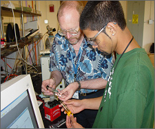 Photo of SULI Program undergraduate student working with a researcher.