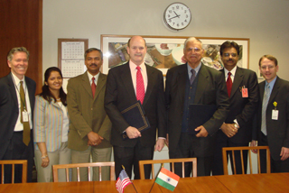 USTDA Regional Director Henry Steingass (far left), India Country Representative Bala Kalyanaraman (third from left) and Country Manager Jason Nagy (far right) are seen here with Deputy Chief of Mission Steven White (fourth from left) and BCL Director Ibrahim Ali (third from right) following the award of the USTDA grant.